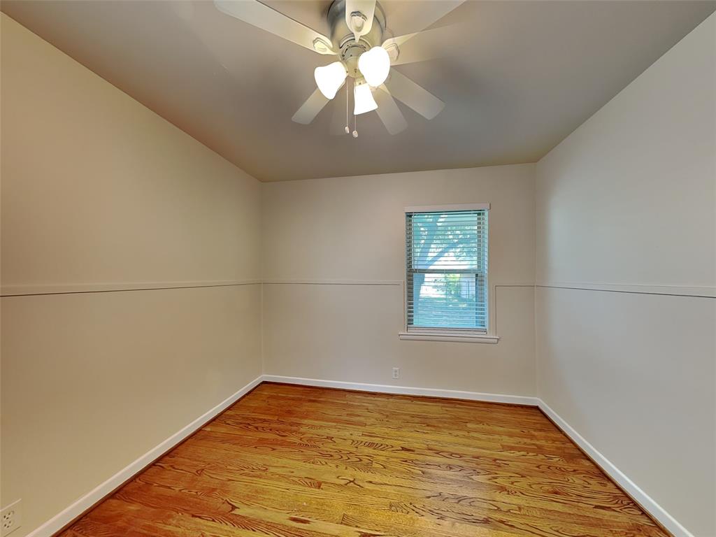 1002 Noble Avenue Carrollton, TX 75006 - Photo 12 of 16 wooden floor in an empty room with a window