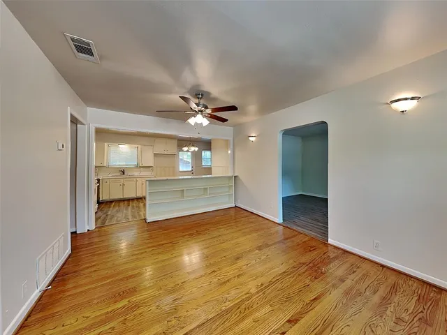 a view of a kitchen with a sink and a living room