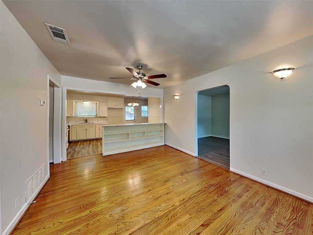 1002 Noble Avenue Carrollton, TX 75006 - Photo 4 of 16 a view of a kitchen with a sink and a living room