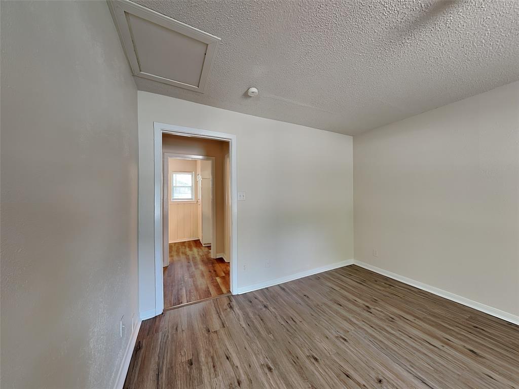 1002 Noble Avenue Carrollton, TX 75006 - Photo 6 of 16 a view of a room with wooden floor