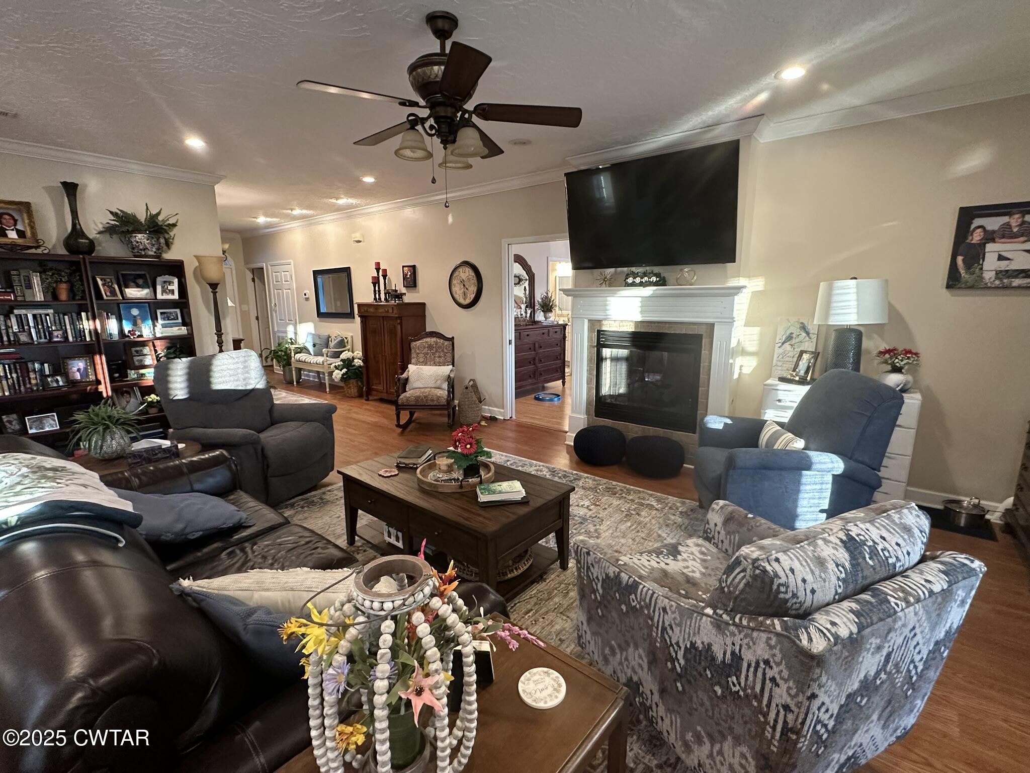 333 Wynridge Troy, TN 38260 - Photo 11 of 38 a living room with furniture a flat screen tv and a fireplace