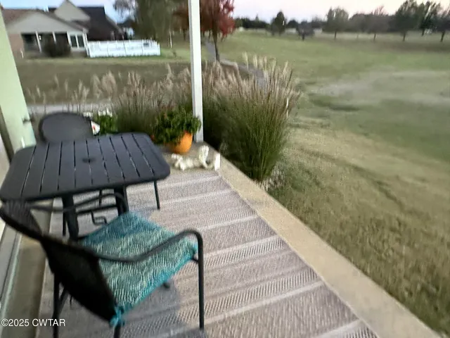 a terrace with outdoor seating and city view