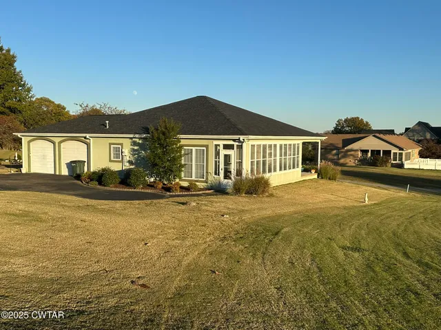 a front view of a house with swimming pool