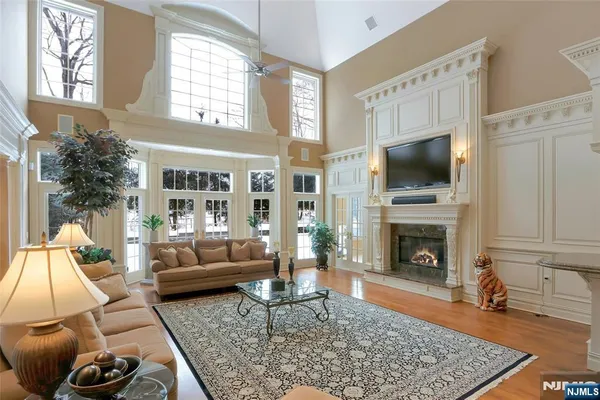a living room with furniture and a chandelier