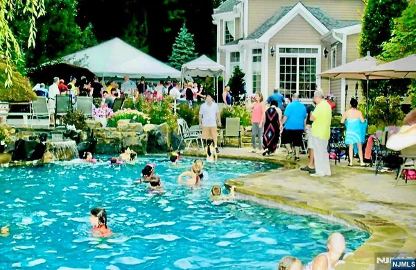 a living room with furniture potted plant and a large window