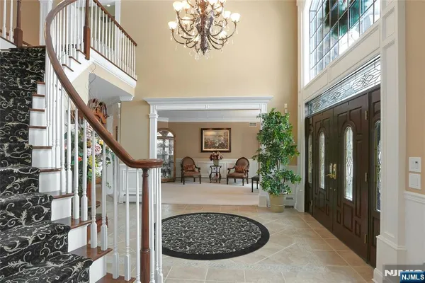a kitchen with stainless steel appliances granite countertop a sink a counter space and cabinets