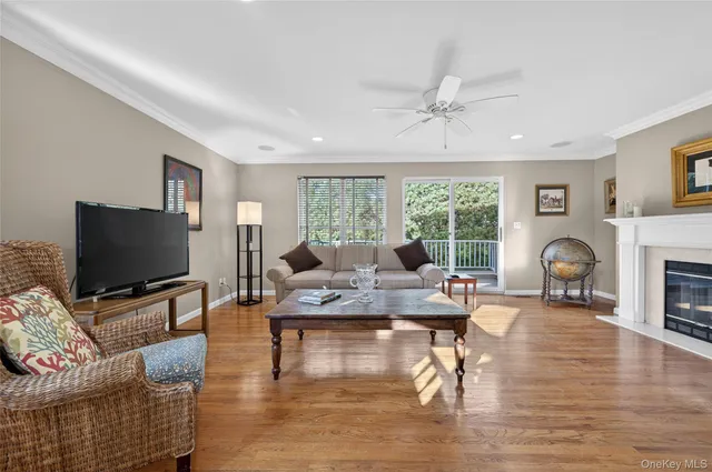 a living room with fireplace furniture and a flat screen tv