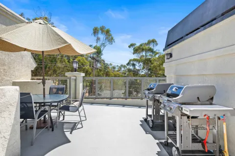 a view of a chairs and table in patio