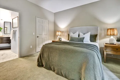 a bedroom with a bed and a couch