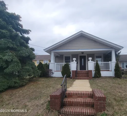 a front view of house with yard outdoor seating and barbeque oven