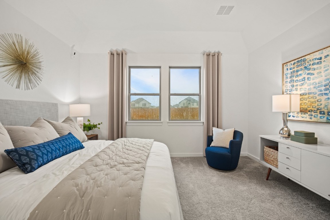 436 Lucky Avenue Elgin, TX 78621 - Photo 16 of 38 a bedroom with a large bed and a window