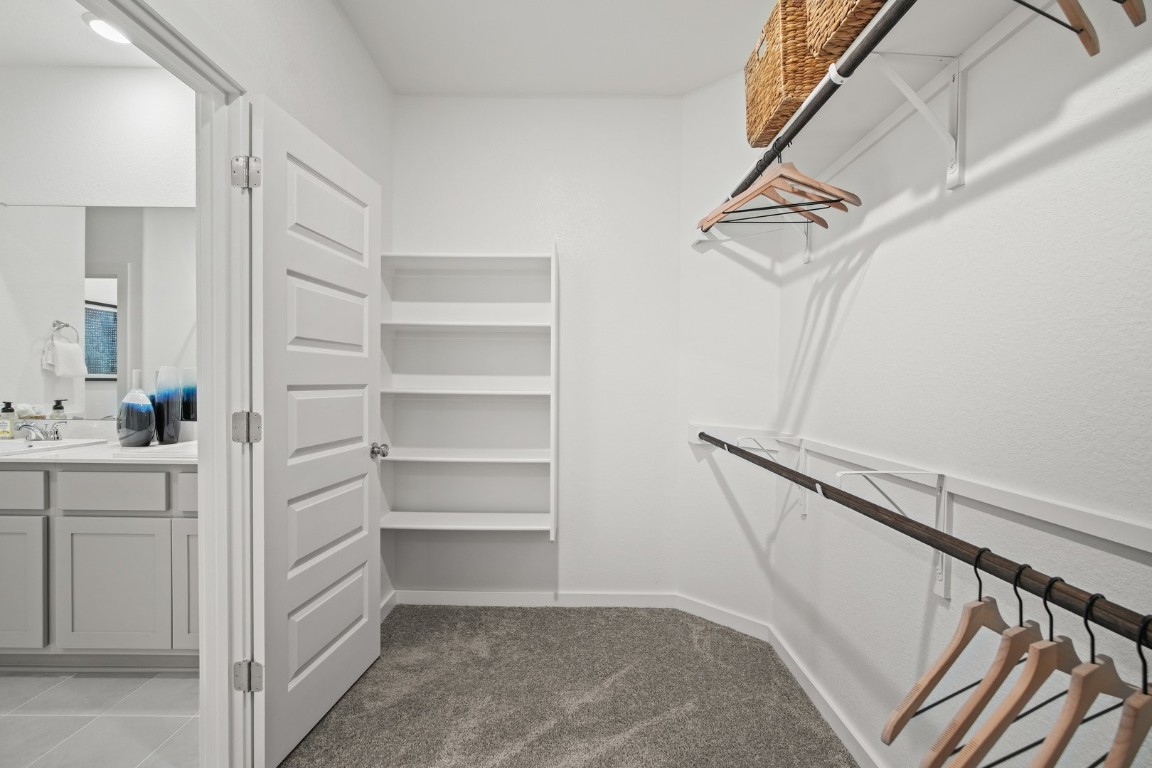 436 Lucky Avenue Elgin, TX 78621 - Photo 21 of 38 a view of walk in closet with empty racks