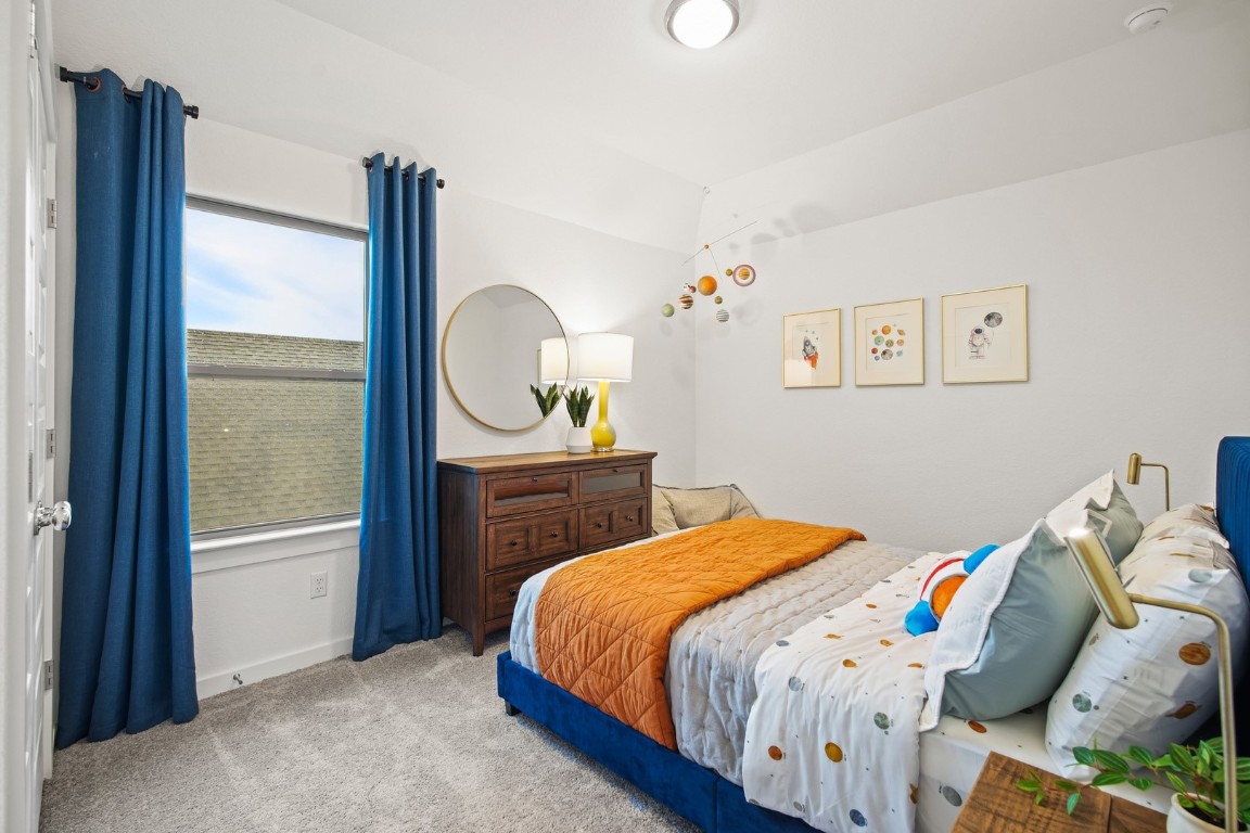 436 Lucky Avenue Elgin, TX 78621 - Photo 25 of 38 a bedroom with a bed and a window