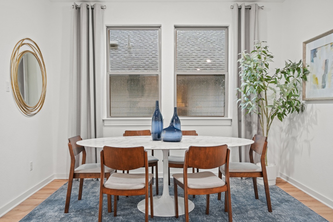 436 Lucky Avenue Elgin, TX 78621 - Photo 9 of 38 a dining room with furniture and a potted plant