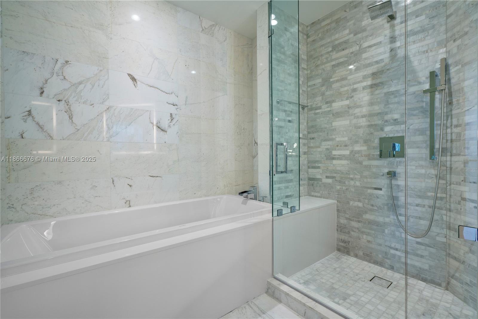 851 Northeast 1st Avenue, Unit 3203 Miami, FL 33132 - Photo 11 of 48 a bathroom with a bathtub and a shower