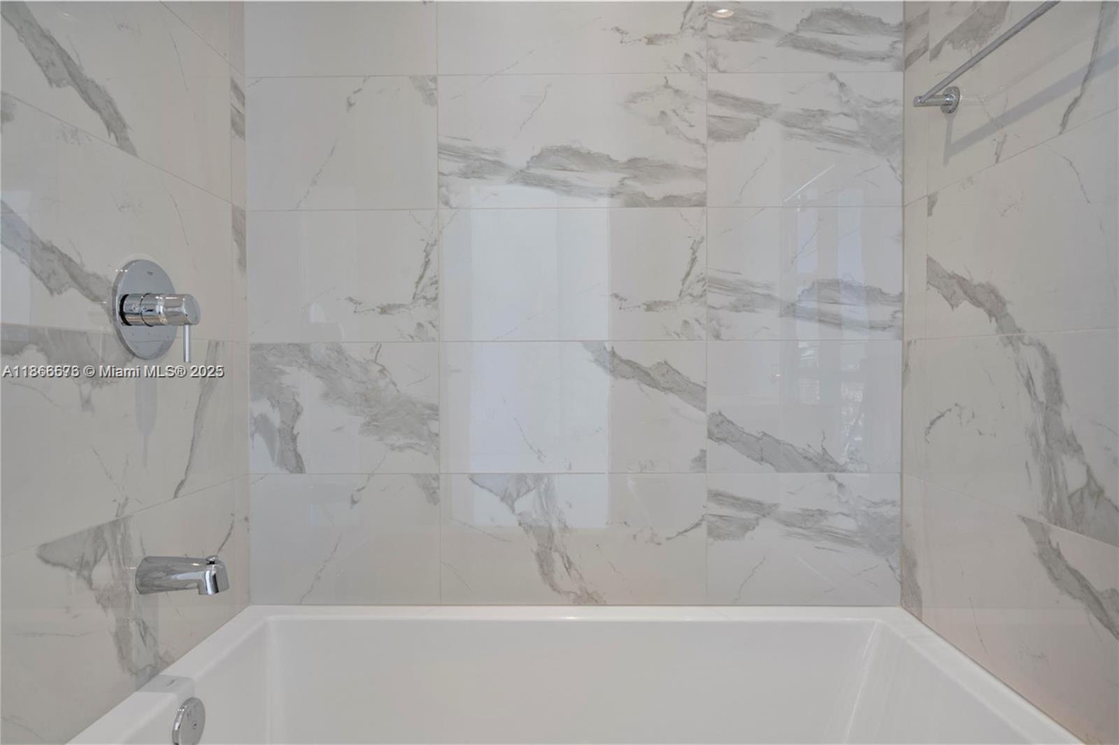 851 Northeast 1st Avenue, Unit 3203 Miami, FL 33132 - Photo 13 of 48 a bathroom with a shower