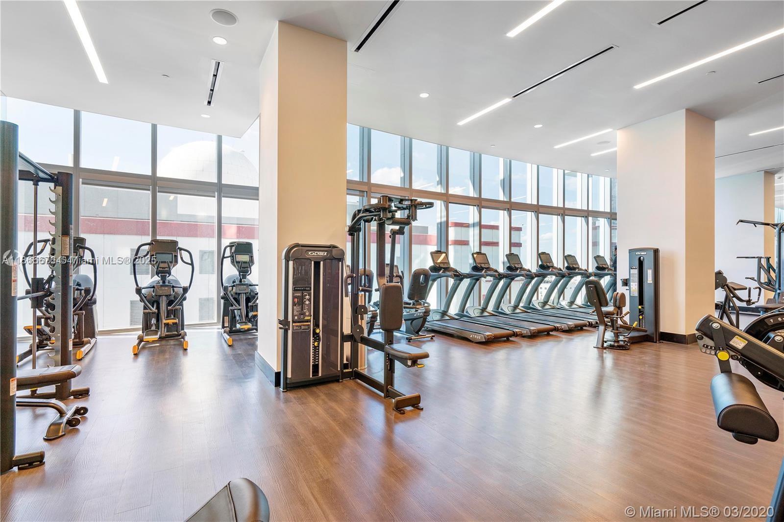 851 Northeast 1st Avenue, Unit 3203 Miami, FL 33132 - Photo 24 of 48 a view of a room with gym equipment