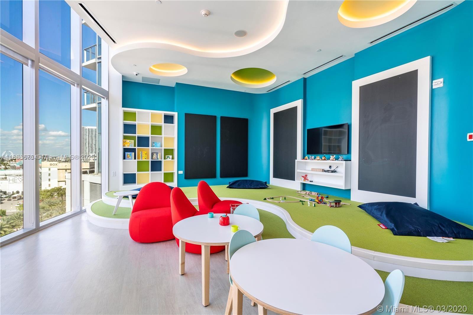 851 Northeast 1st Avenue, Unit 3203 Miami, FL 33132 - Photo 25 of 48 a view of a dining room with furniture and chandelier