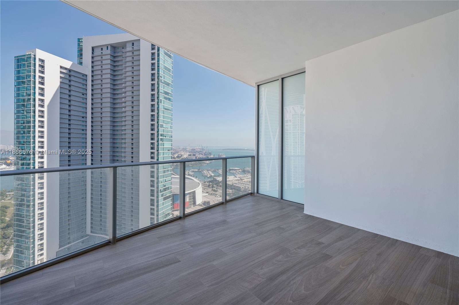 851 Northeast 1st Avenue, Unit 3203 Miami, FL 33132 - Photo 3 of 48 a view of staircase with wooden floor and railing