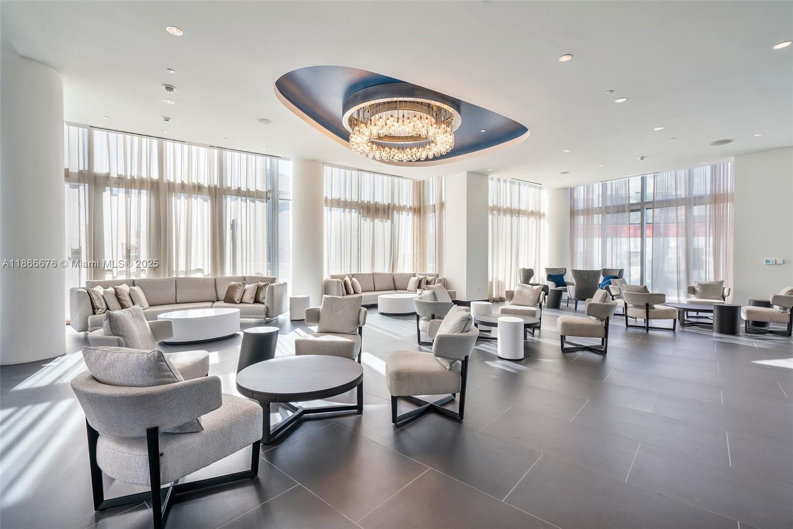 851 Northeast 1st Avenue, Unit 3203 Miami, FL 33132 - Photo 40 of 48 a living room with furniture and a large window