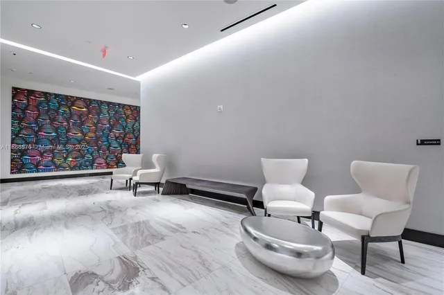 a front view of multi story residential apartment building with yard