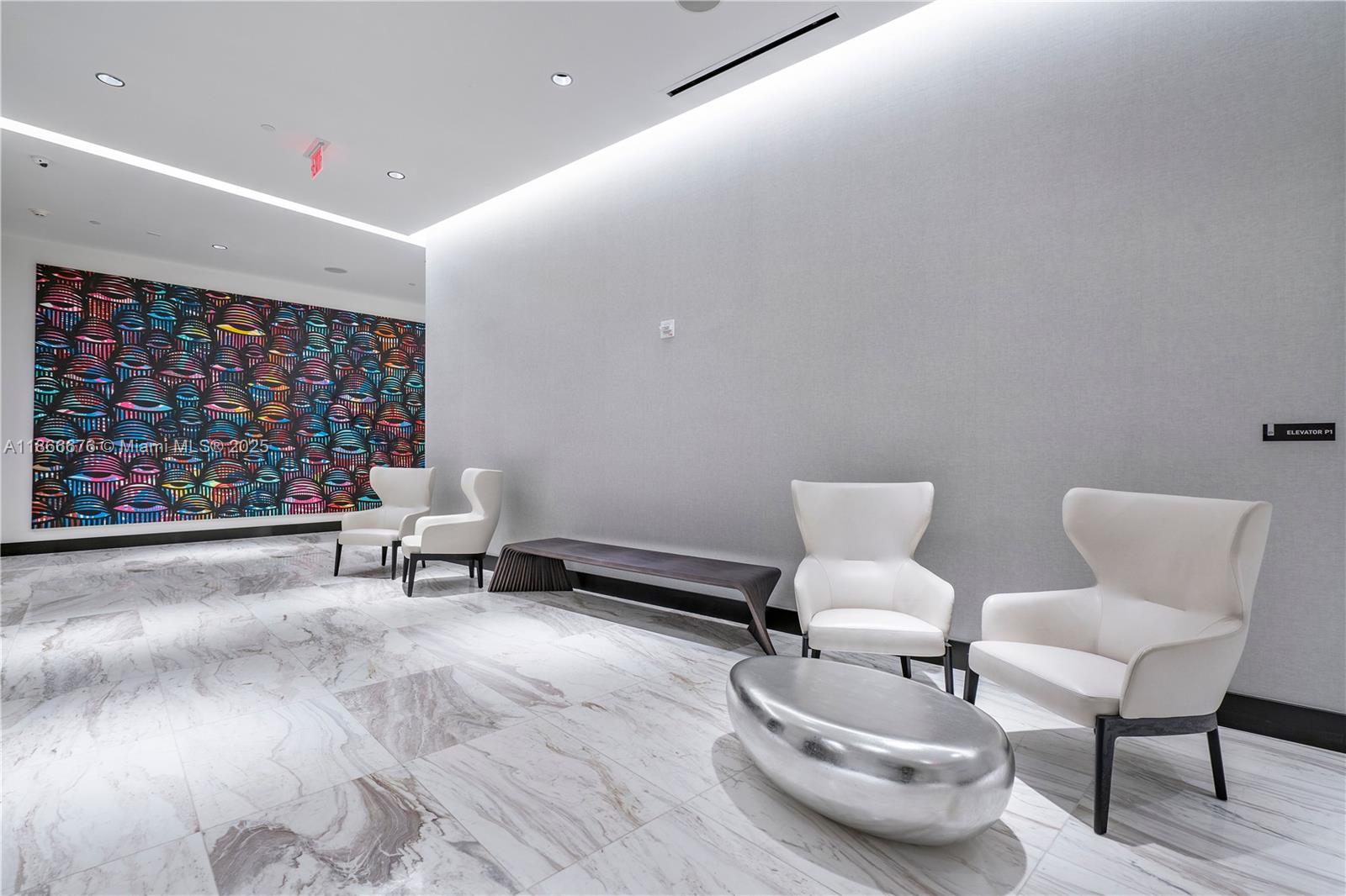 851 Northeast 1st Avenue, Unit 3203 Miami, FL 33132 - Photo 45 of 48 a living room with furniture and a rug