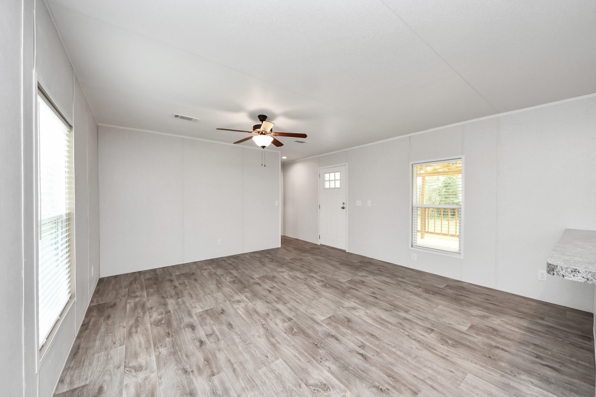 1560 Brown Road Willis, TX 77378 - Photo 13 of 28 wooden floor in an empty room with a window