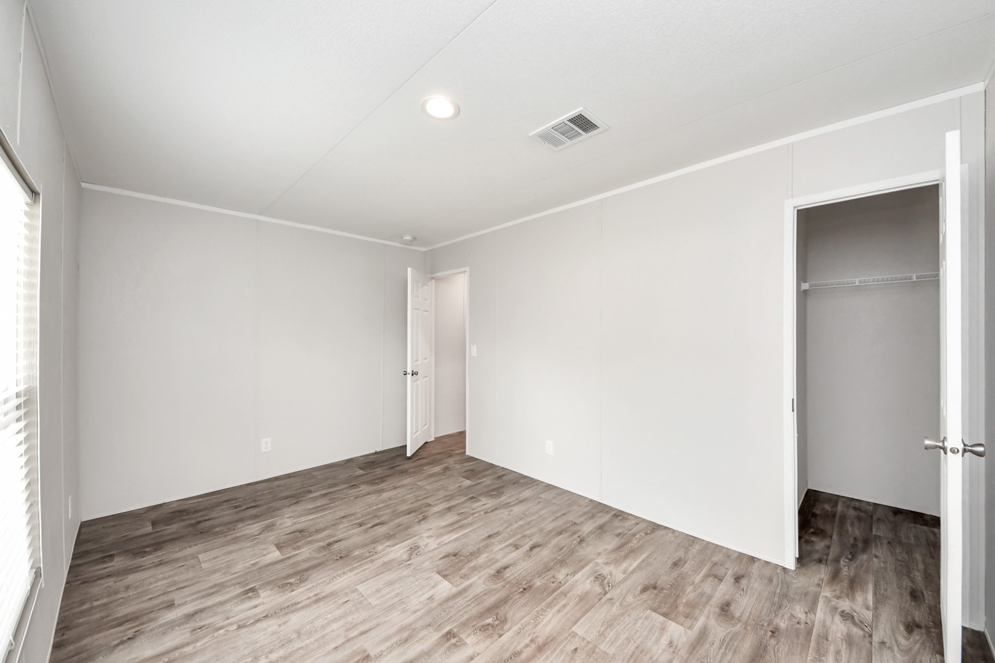 1560 Brown Road Willis, TX 77378 - Photo 16 of 28 an empty room with wooden floor