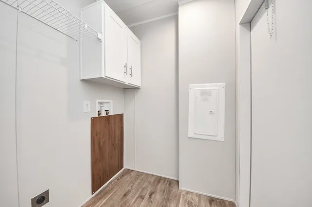 a view of cabinets and wooden floor