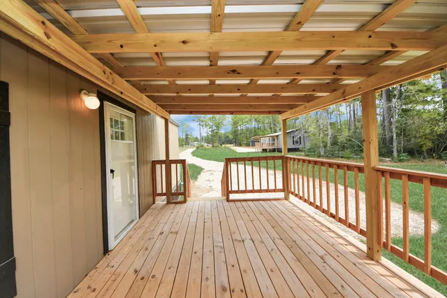 a view of porch with wooden floor