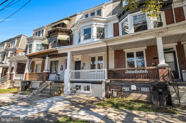 a front view of a building with many windows