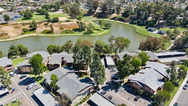 an aerial view of a house with outdoor space and lake view