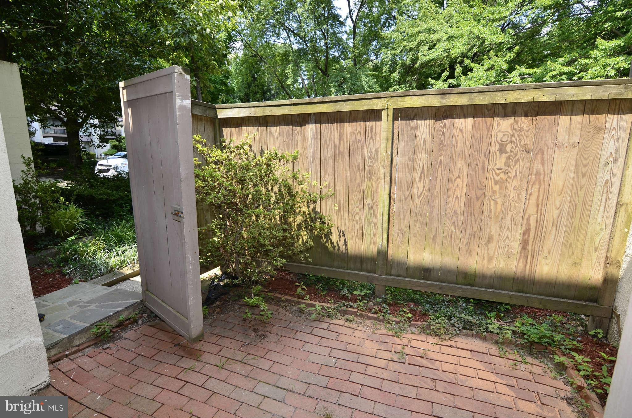11703 Newbridge Court Reston, VA 20191 - Photo 18 of 25 Brick patio in front of home