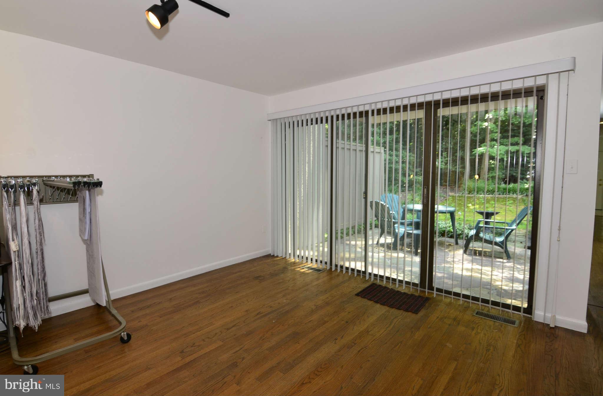 11703 Newbridge Court Reston, VA 20191 - Photo 7 of 25 Living room that leads to flagstone patio