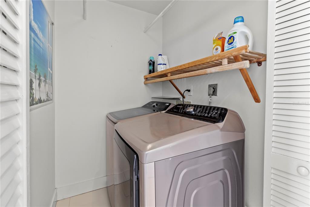 400 Golden Gate Point, Unit 11 Sarasota, FL 34236 - Photo 13 of 42 a utility room with dryer and washer