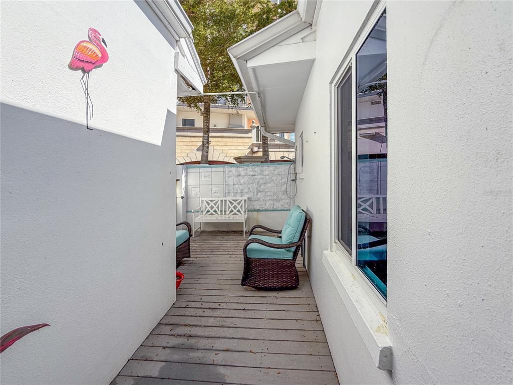 400 Golden Gate Point, Unit 11 Sarasota, FL 34236 - Photo 26 of 42 a view of a hallway with seating space
