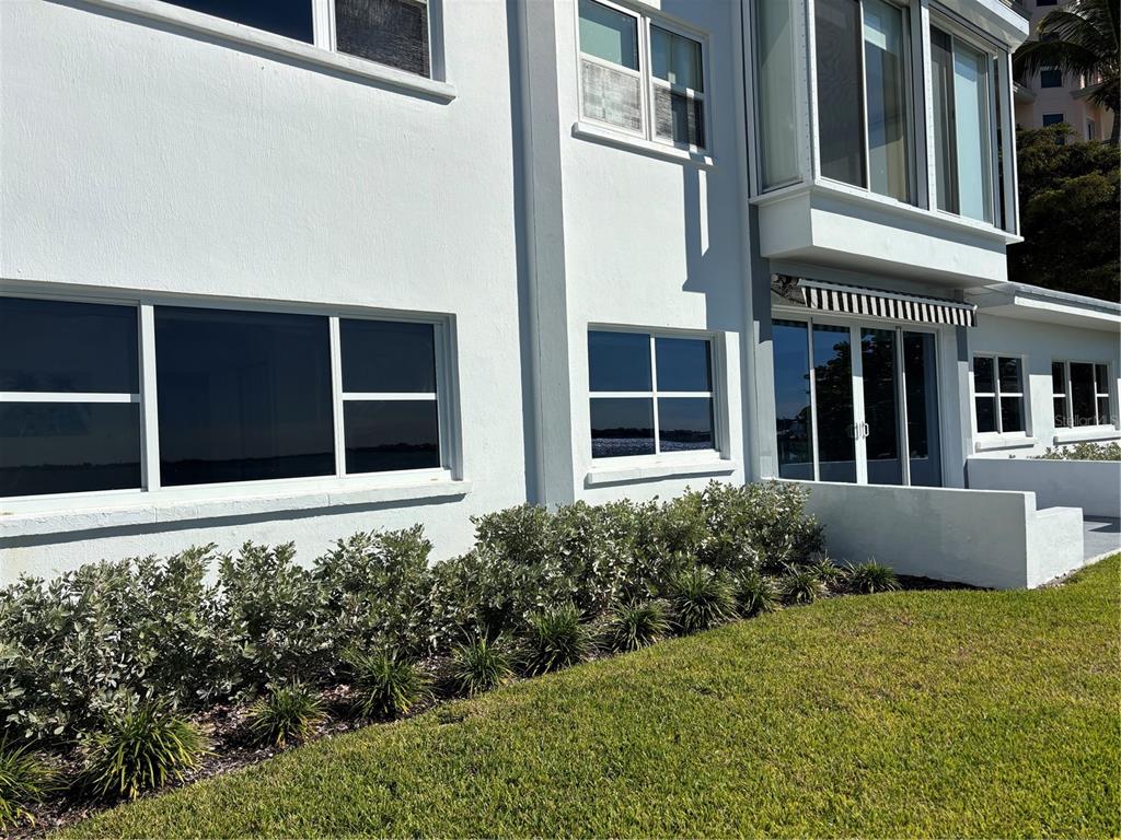 400 Golden Gate Point, Unit 11 Sarasota, FL 34236 - Photo 30 of 42 a view of a house with a garden