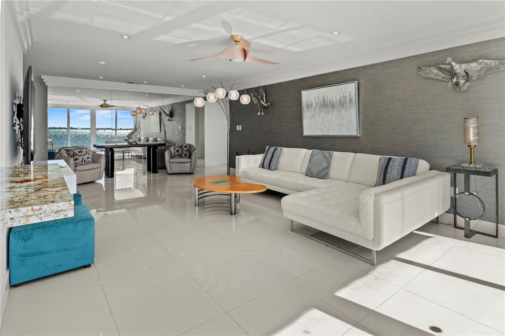 400 Golden Gate Point, Unit 11 Sarasota, FL 34236 - Photo 6 of 42 a living room with furniture and wooden floor