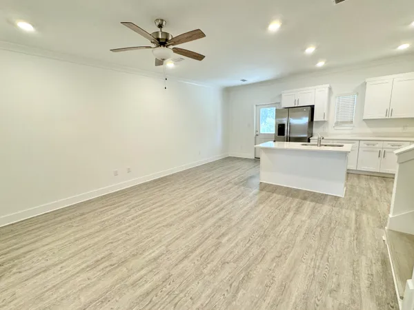 a kitchen with stainless steel appliances refrigerator stove microwave and cabinets