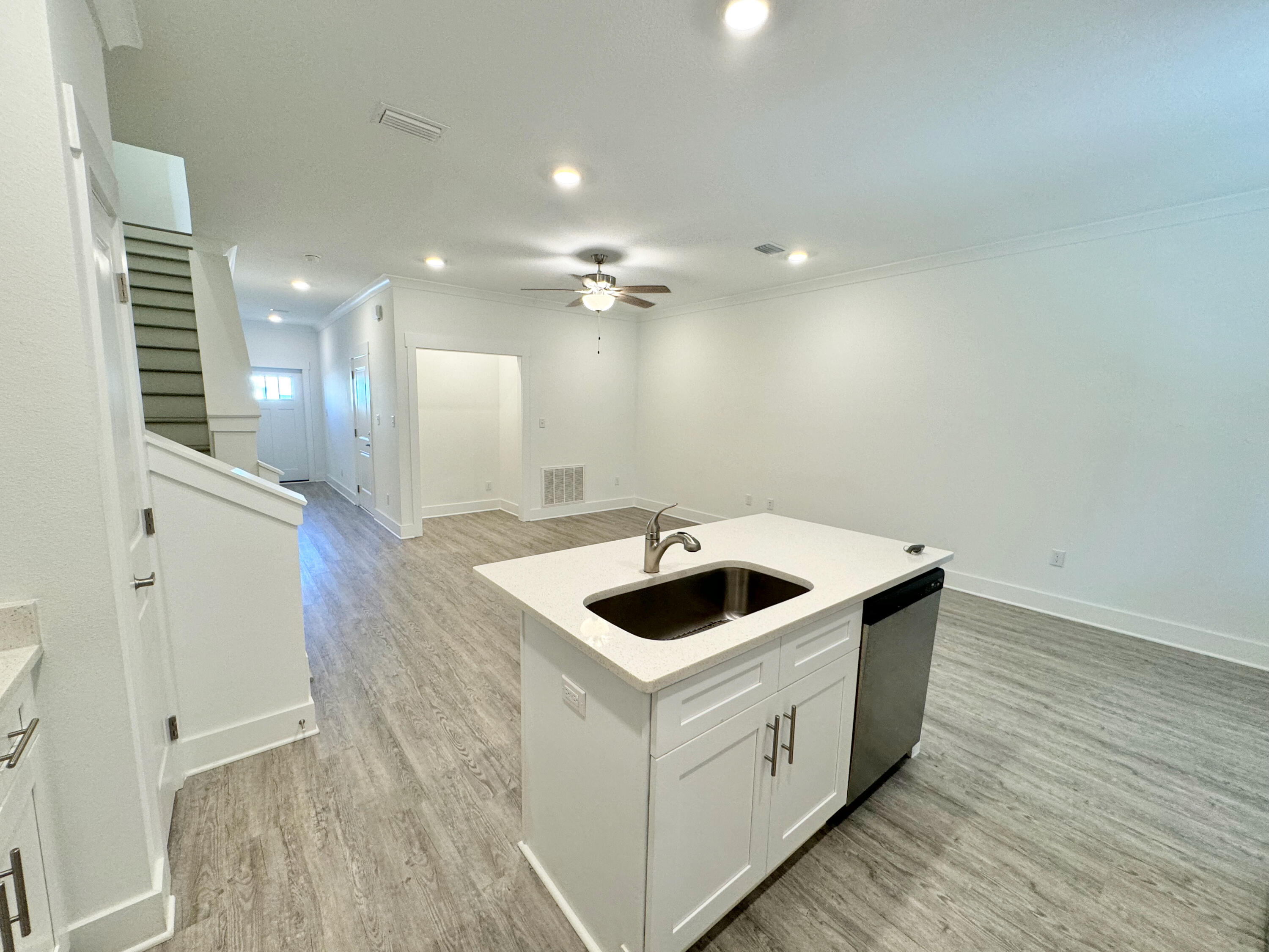 103 Date Palm Lane Freeport, FL 32439 - Photo 16 of 33 a kitchen with a sink and a stove top oven