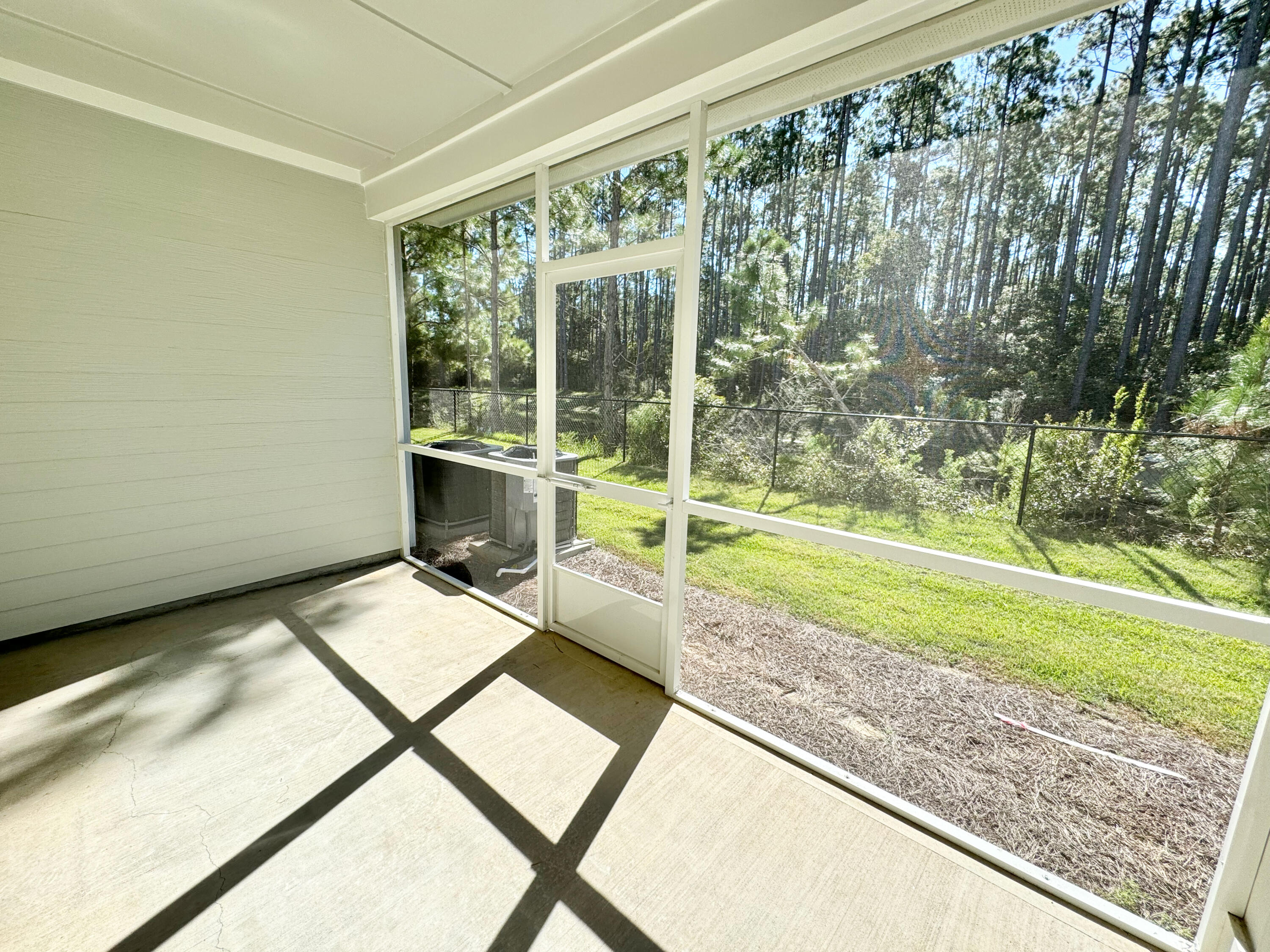 103 Date Palm Lane Freeport, FL 32439 - Photo 17 of 33 a view of a porch with a backyard