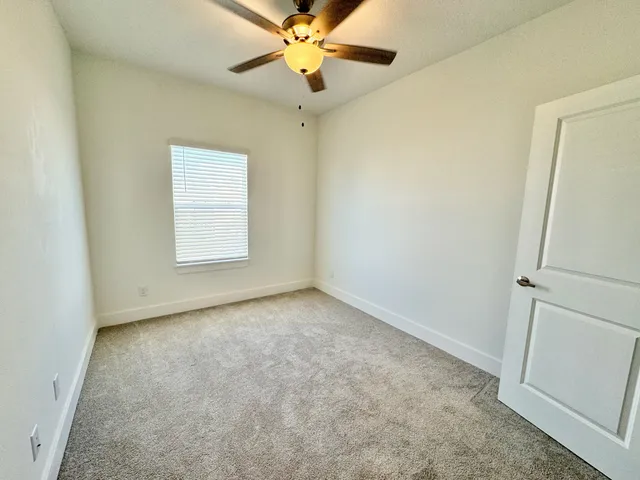 an empty room with a bathroom
