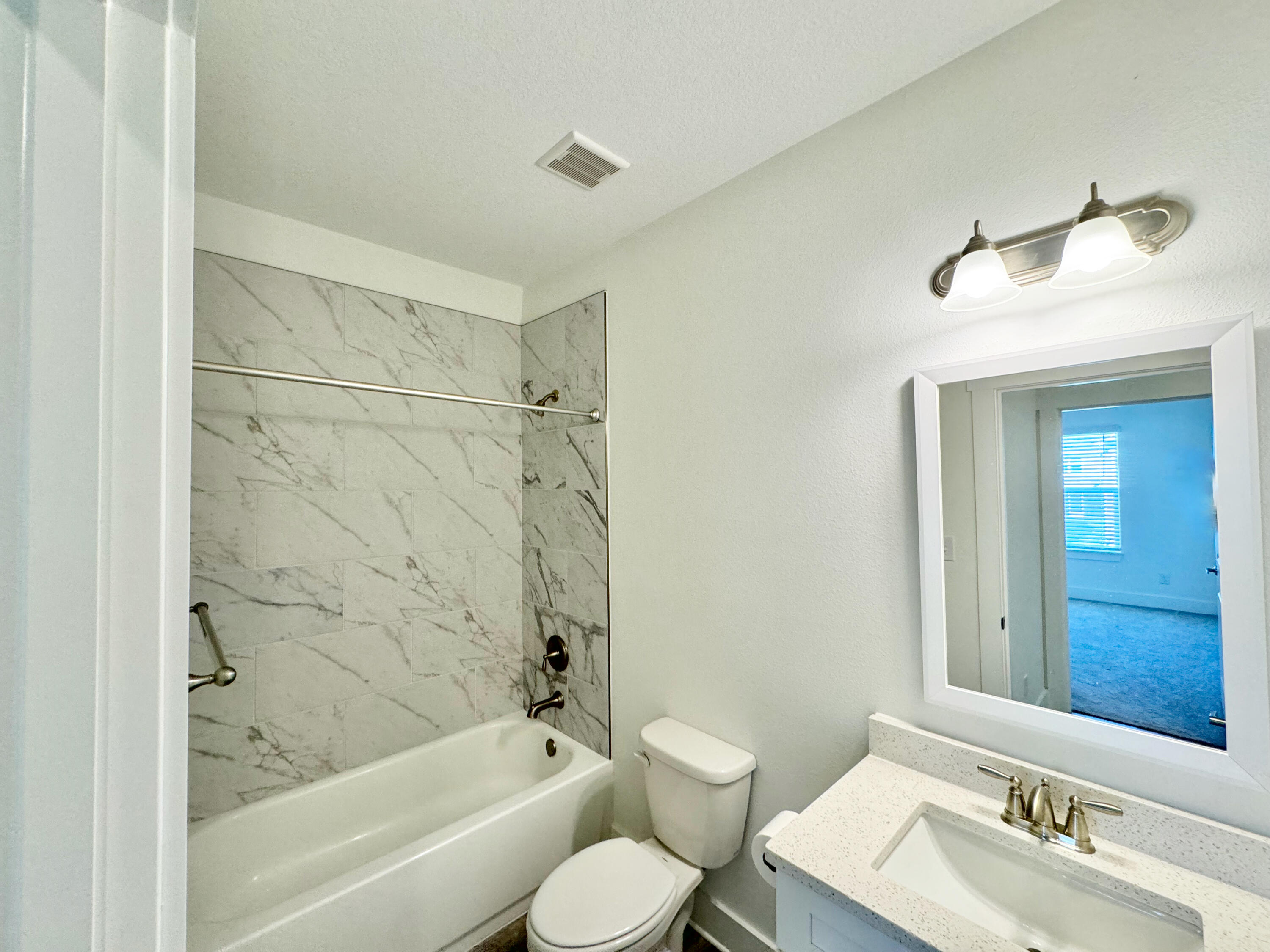 103 Date Palm Lane Freeport, FL 32439 - Photo 27 of 33 a bathroom with a sink toilet and shower