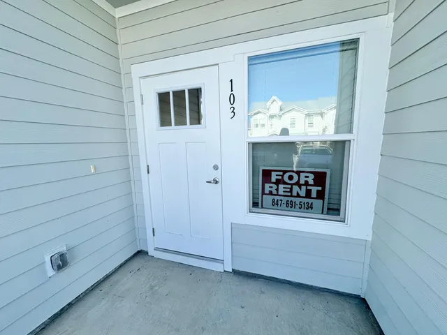 a view of a door and a window