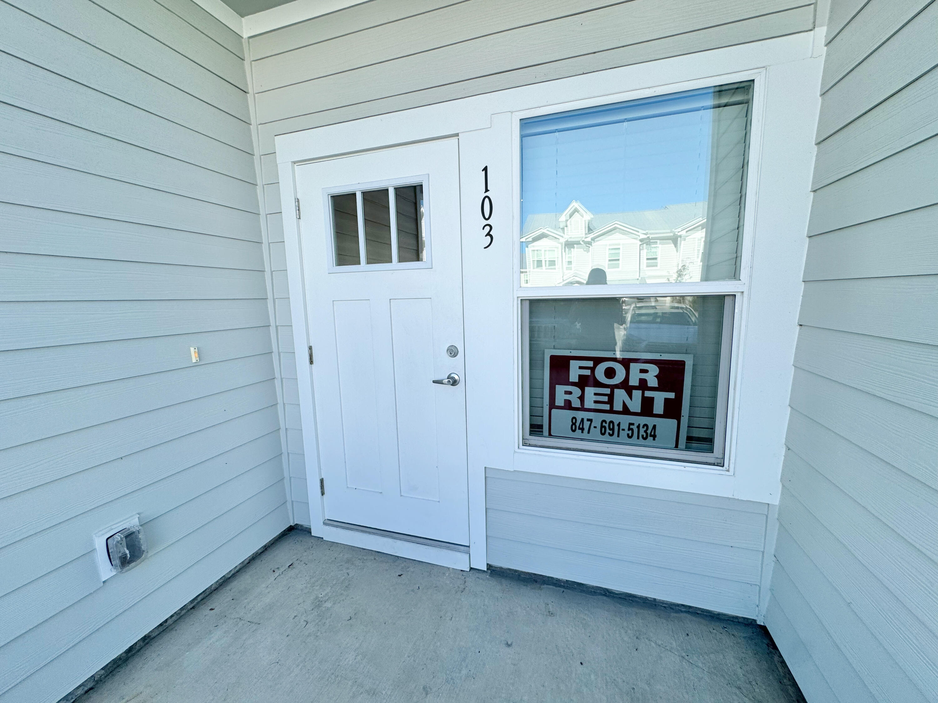 103 Date Palm Lane Freeport, FL 32439 - Photo 3 of 33 a view of a door and a window