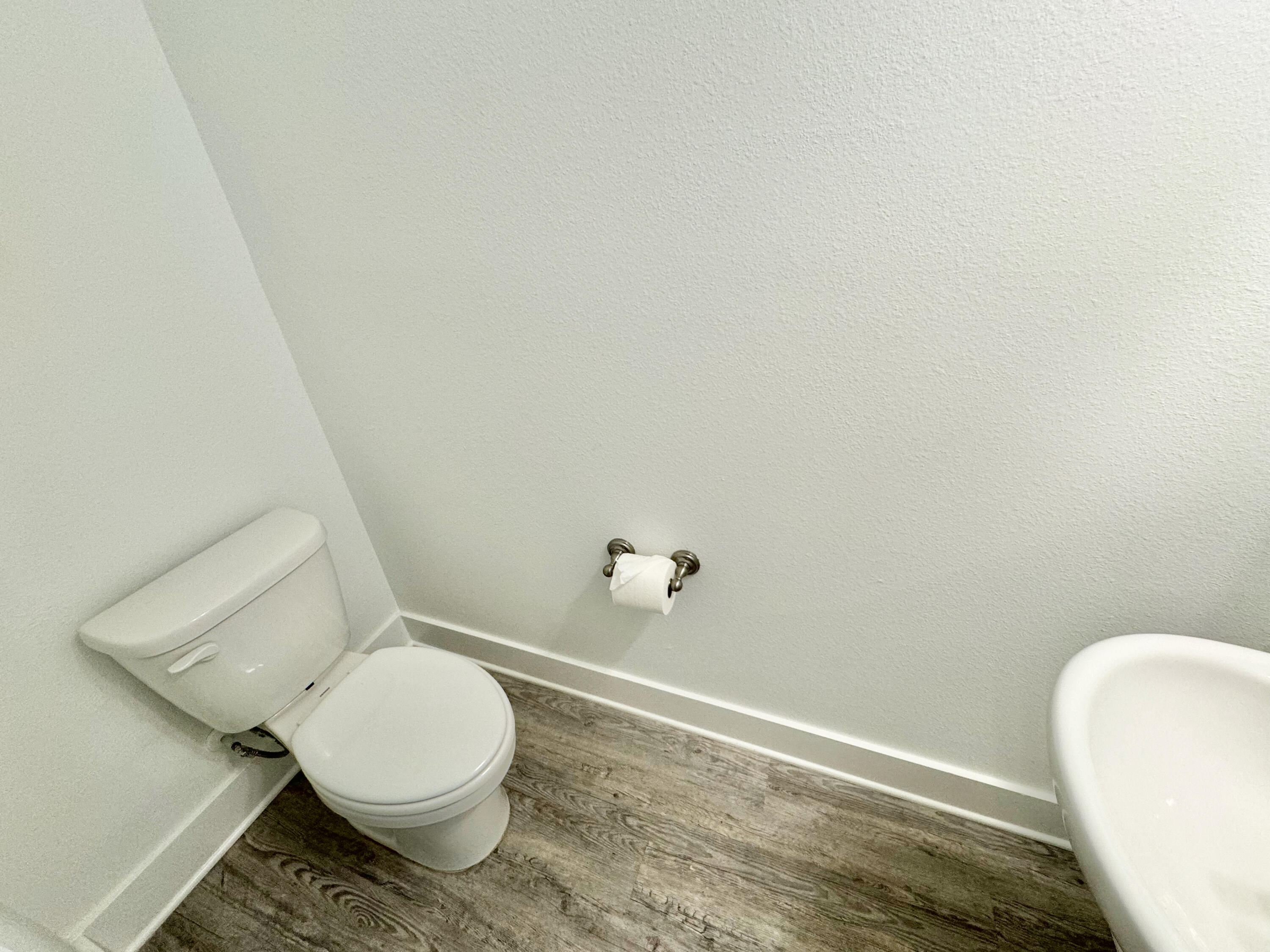 103 Date Palm Lane Freeport, FL 32439 - Photo 9 of 33 a bathroom with a toilet and a rug