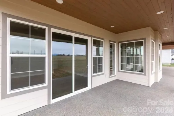 a view of an empty room with a large window