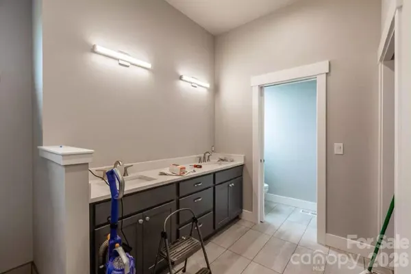 a room with a sink and cabinets