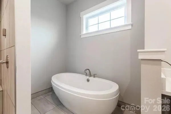 a white bath tub sitting in a bathroom