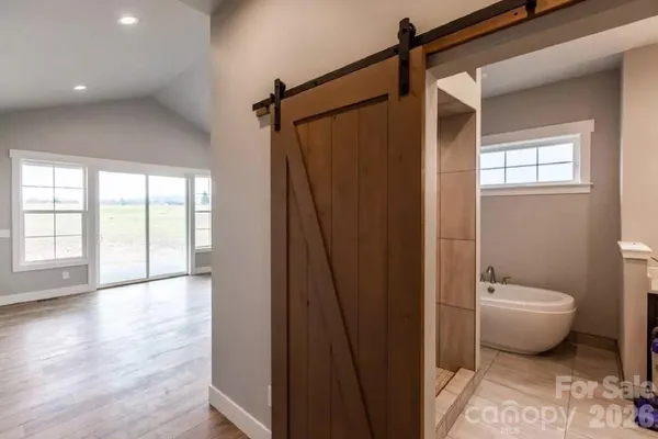 a bathroom with a toilet a sink and shower